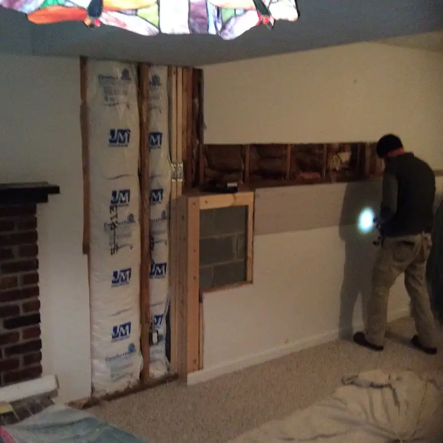 Restoration technician inspecting water damage in Canton